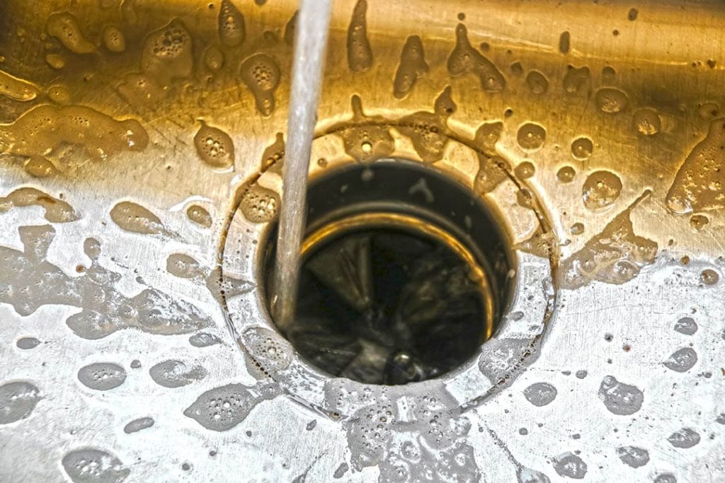 How to Unclog a Garbage Disposal (7 Quick & Easy Steps)
