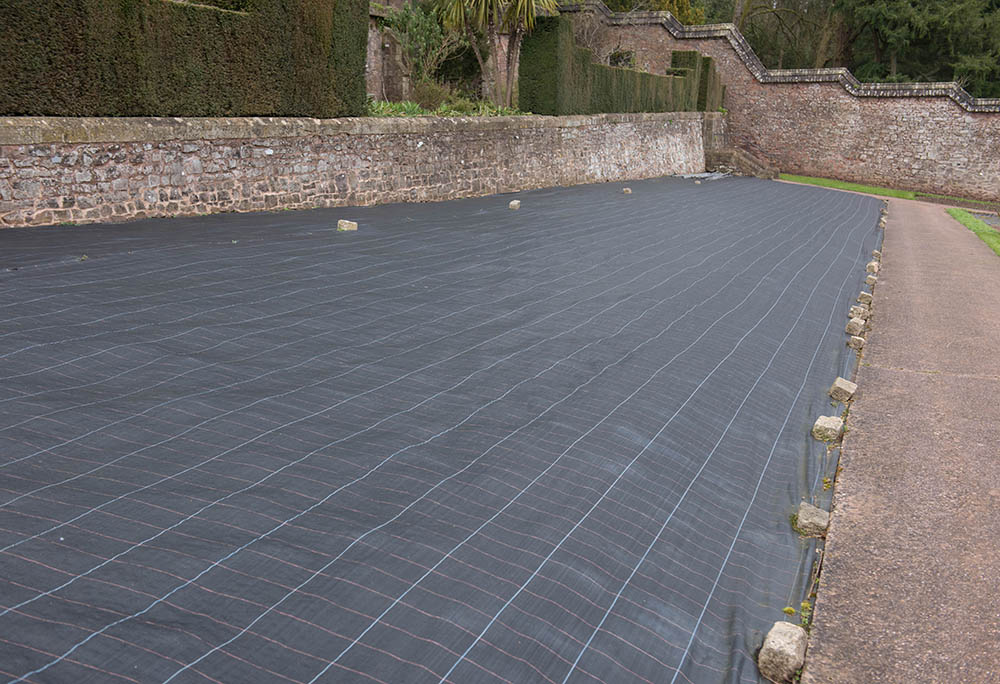 How To Lay Landscape Fabric In 8 Simple Steps (with Pictures)